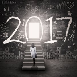 woman standing in stairwell looking at 2017 in black and white